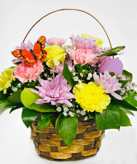 easter basket filled with pastel flowers and butterfly accents